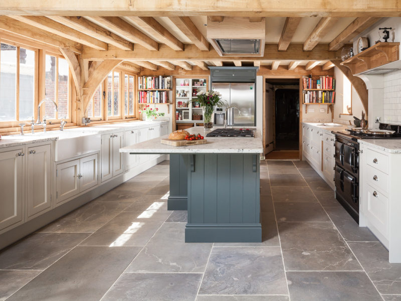 kitchen with beams tiled floors and island