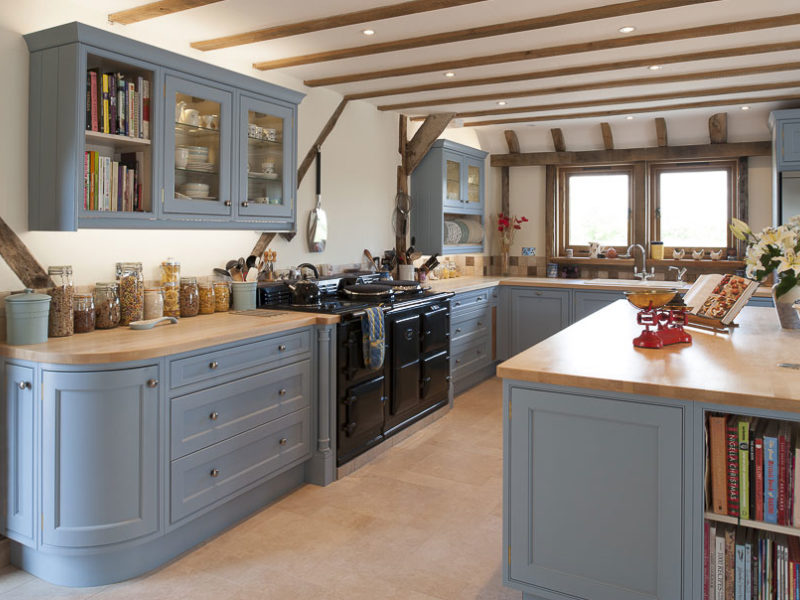 light blue kitchen with beams and storage