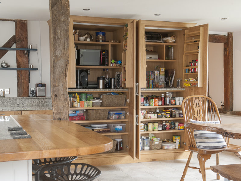 wood kitchen with shelving and dining table
