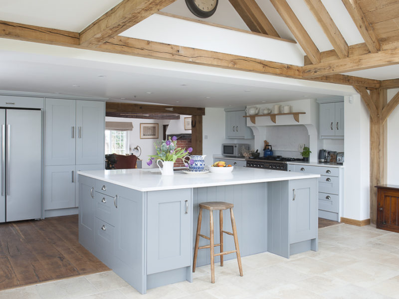 farmhouse kitchen with island and beams