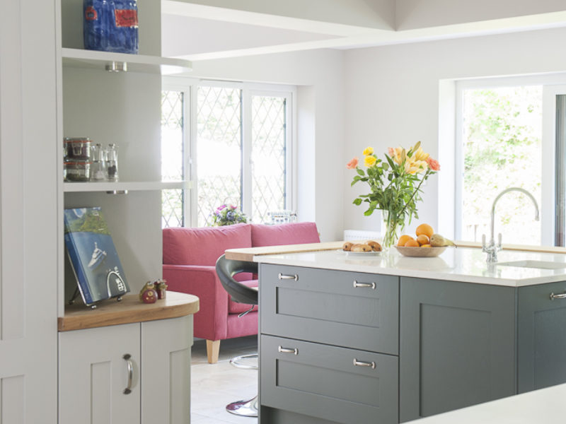 grey kitchen with tiled floor and shelving