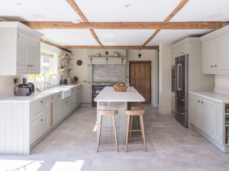 farmhouse kitchen with beams and breakfast bar