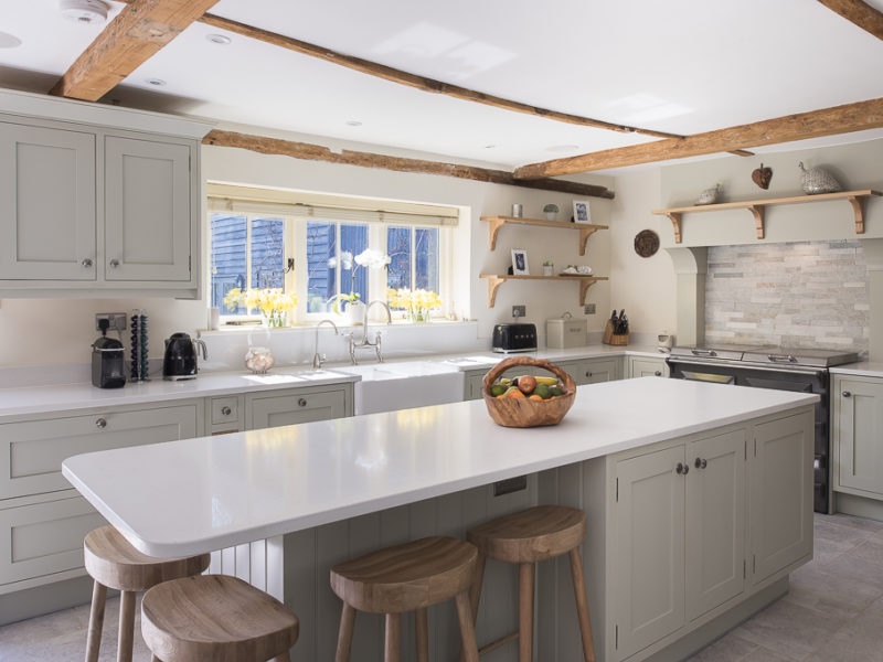 farmhouse kitchen with windows and breakfast bar