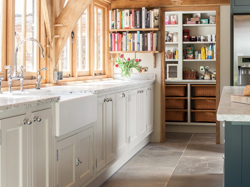 kitchen with beams and stone floor