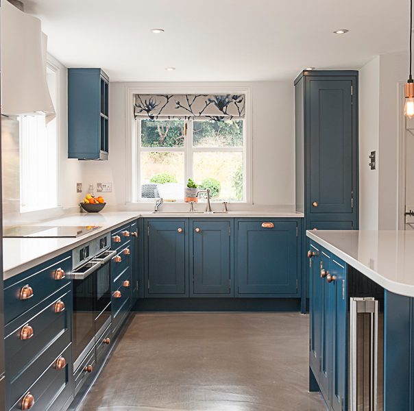 modern blue kitchen with copper details
