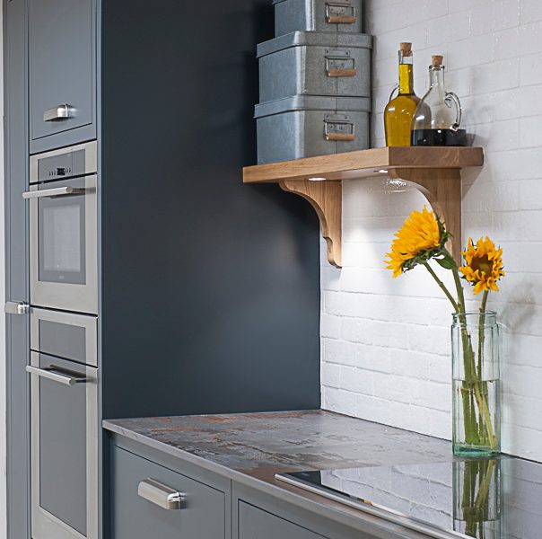 minimal dark grey kitchen with sunflowers