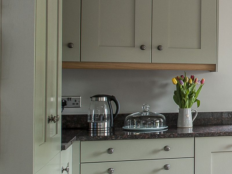 kitchen with kettle and flowers