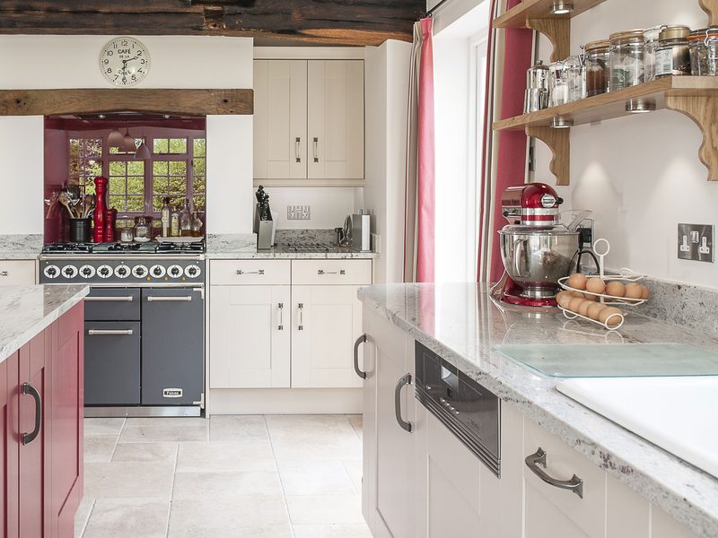 kitchen with red island and shelving