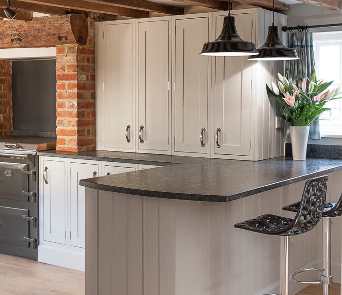 breakfast bar with beams and metal barstools