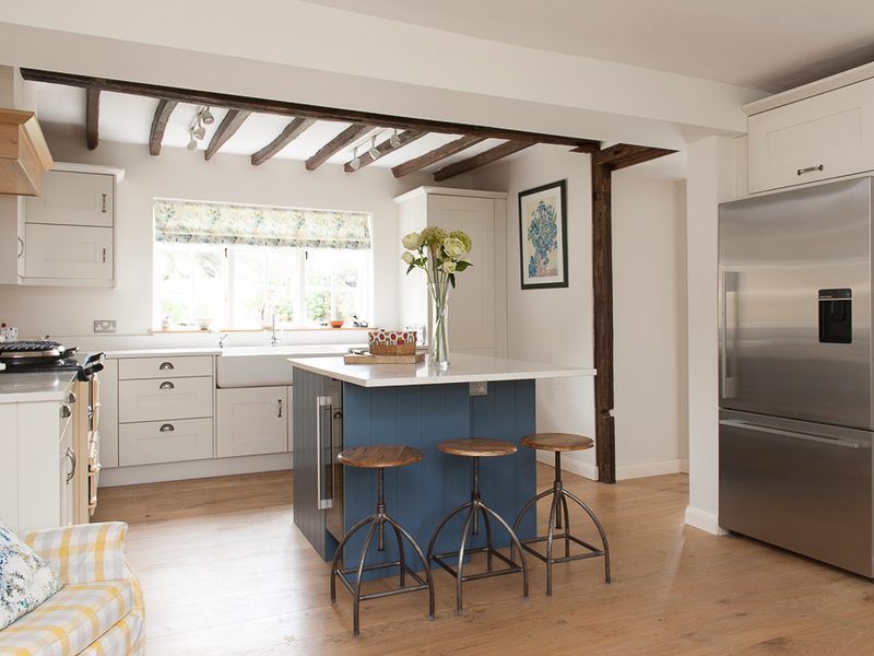 cottage kitchen with beams and wood floor