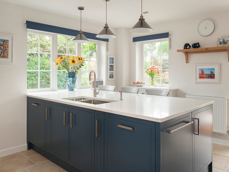 blue kitchen island with french windows