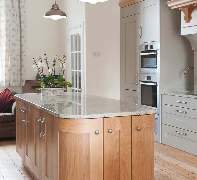 wood kitchen island with pendant lamps