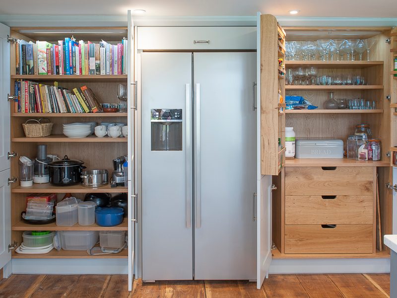farmhouse kitchen with wood floor and shelving