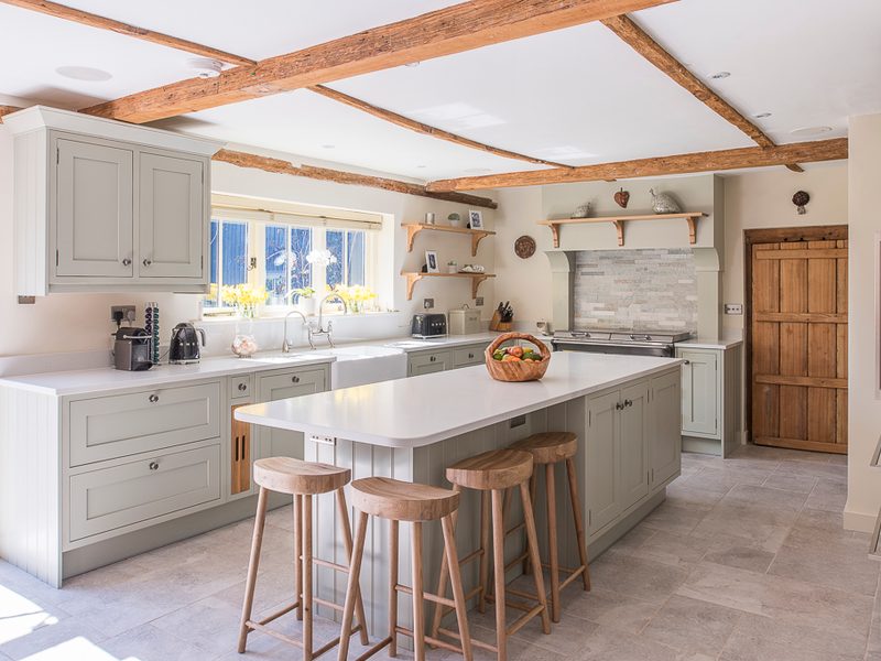 charming farmhouse kitchen with beams and island