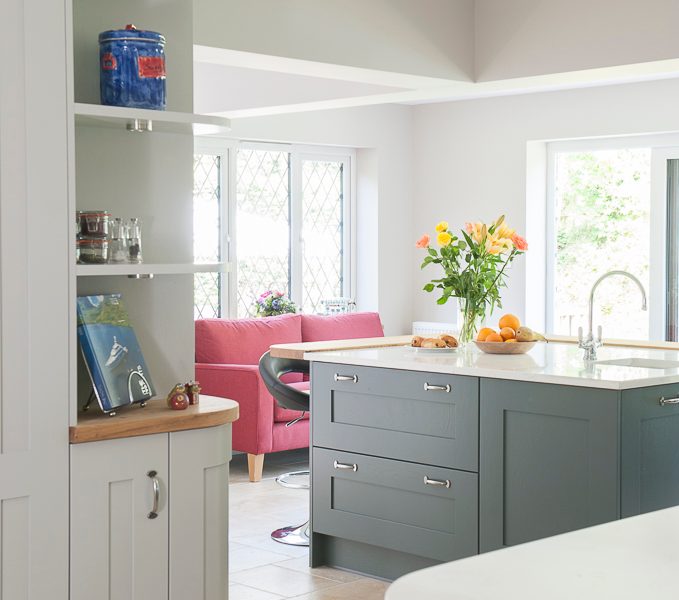 grey kitchen with tiled floor and shelving