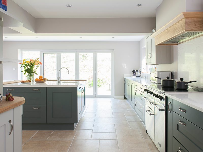 sophisicated kitchen with tiled floor and island