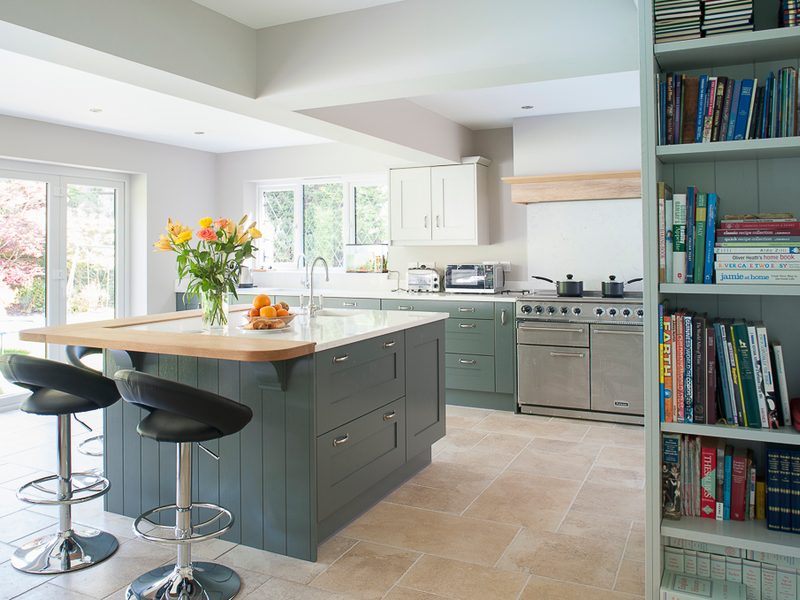light filled kitchen with shelving and barstools