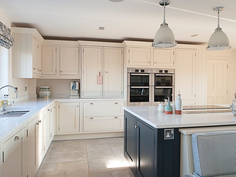 monochrome kitchen with island and pendant lamps