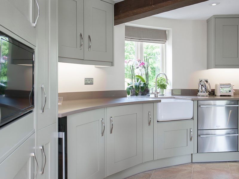 unusual grey round kitchen with belfast sink