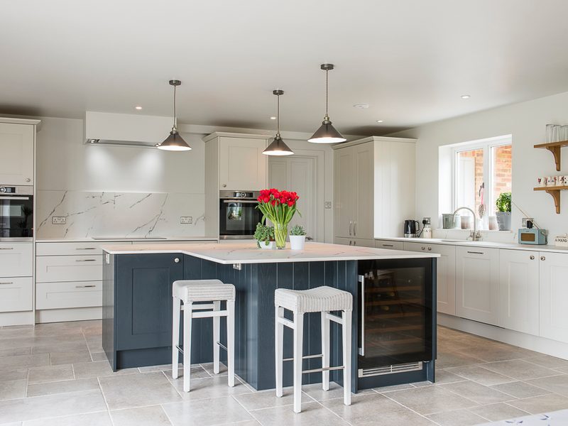 monochrome kitchen with island and bar stools