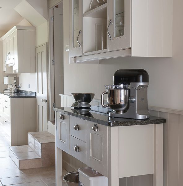 galley kitchen with freestanding storage