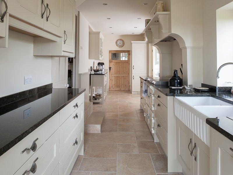 classic galley kitchen with tiled floor