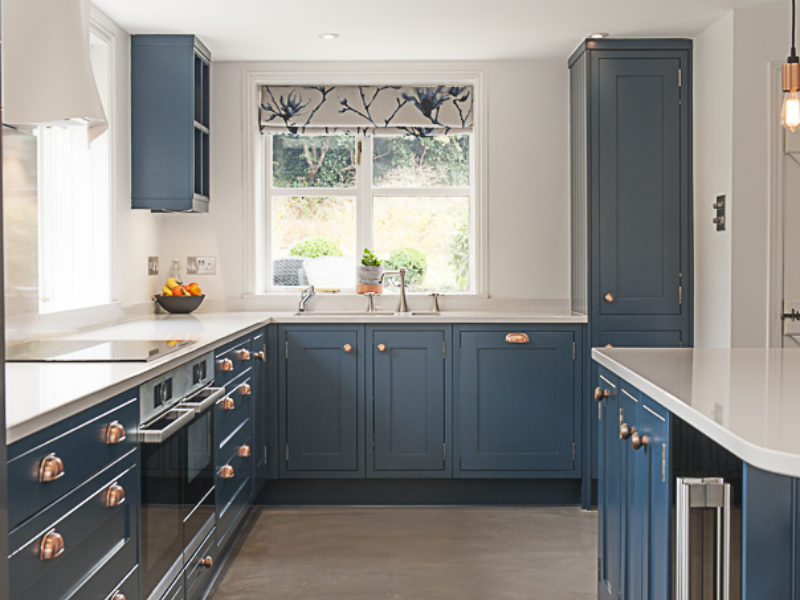 modern blue kitchen with copper details