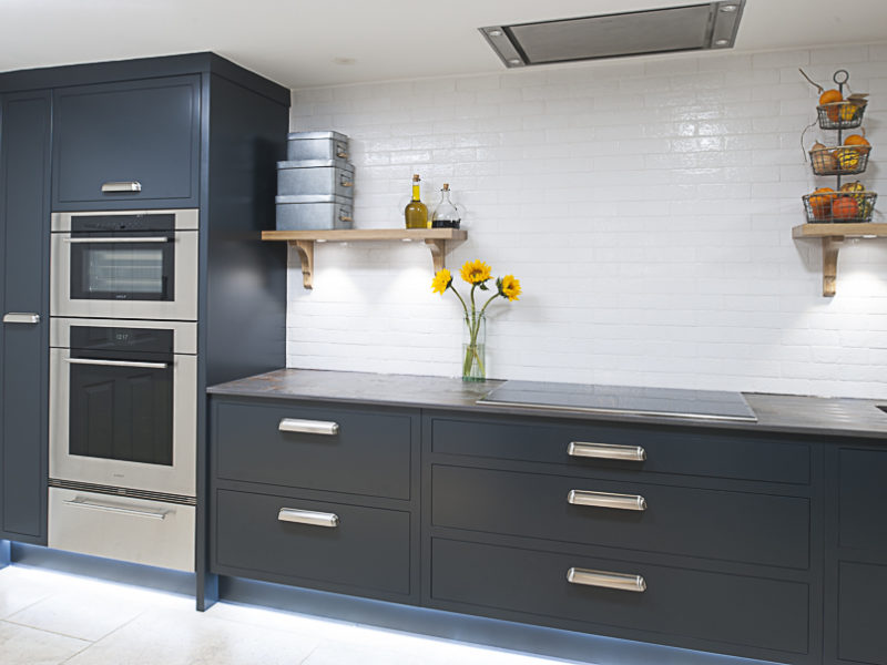 minimal dark grey kitchen with tiled splashback