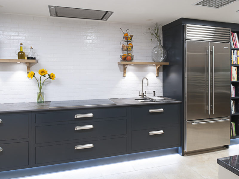 minimal dark grey kitchen with american style fridge