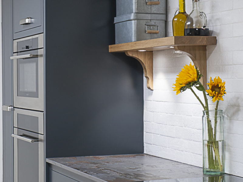 minimal dark grey kitchen with sunflowers