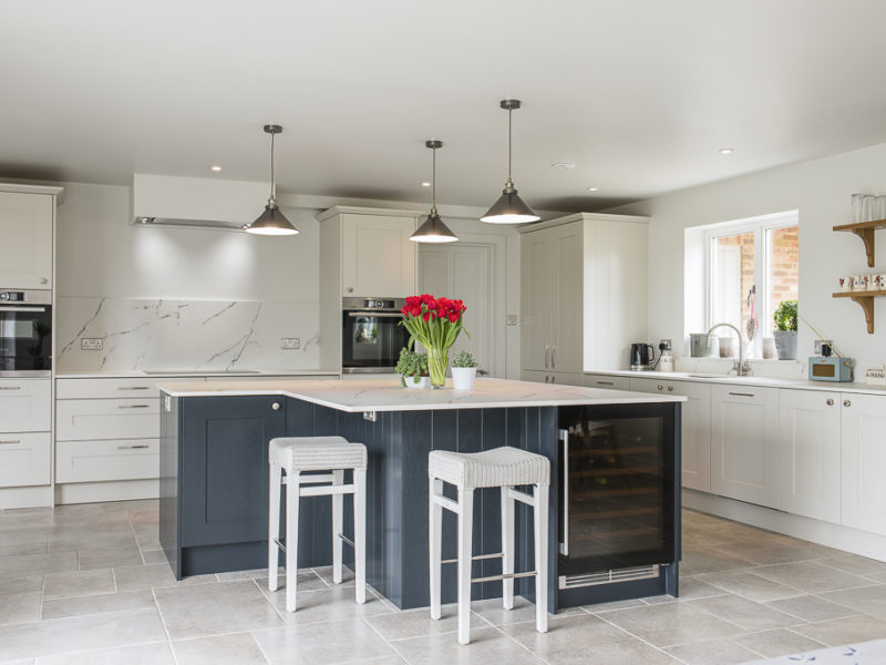 monochrome kitchen with island and bar stools